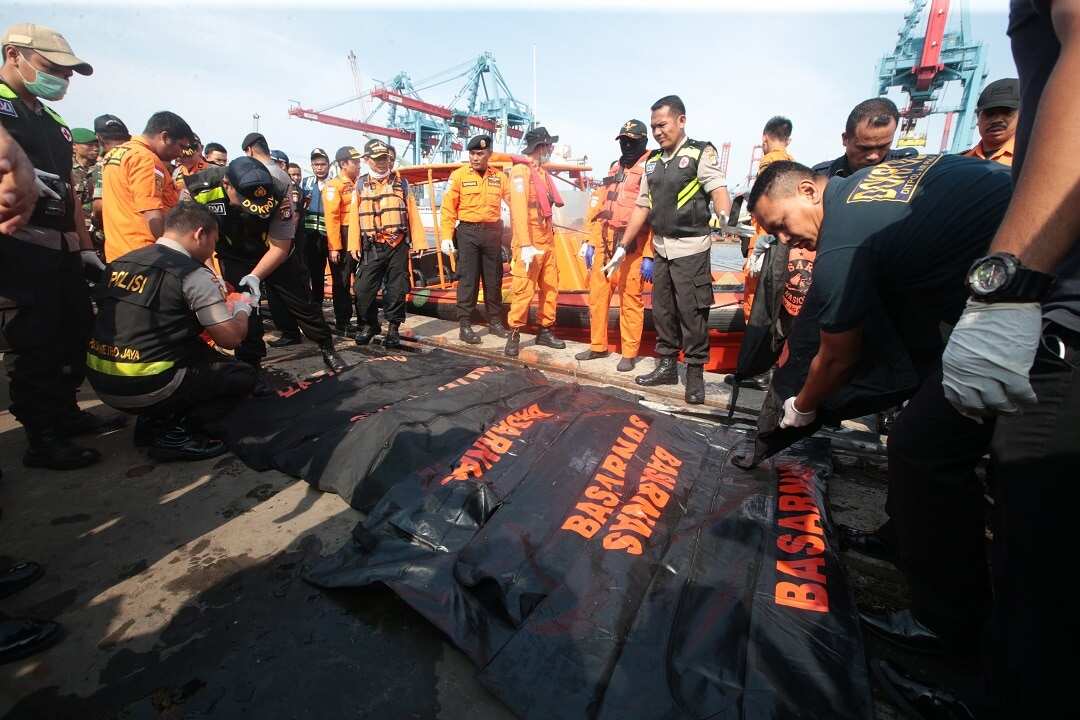 Indonesian rescue team members have retrieved body parts from the water where a plane crashed.
