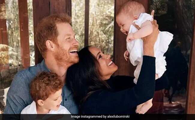 Prince Harry and Meghan Markle share the first image of their daughter Lilibet in their family Christmas photo