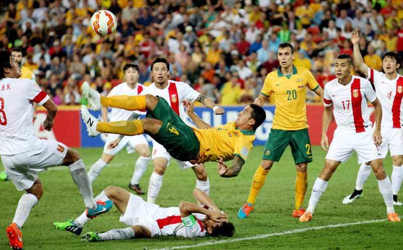 Australia's Tim Cahill performs a overhead kick to score Australia's first goal during the AFC Asia Cup quarterfinal soccer match between China and Australia in Brisbane, Australia, Thursday, Jan. 22, 2015. (AP Photo/Tertius Pickard)