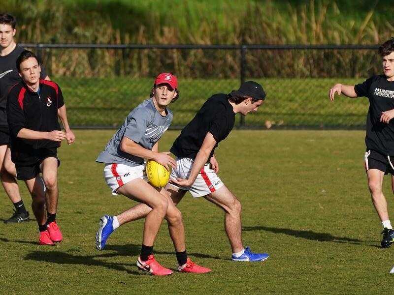 People playing football in a park