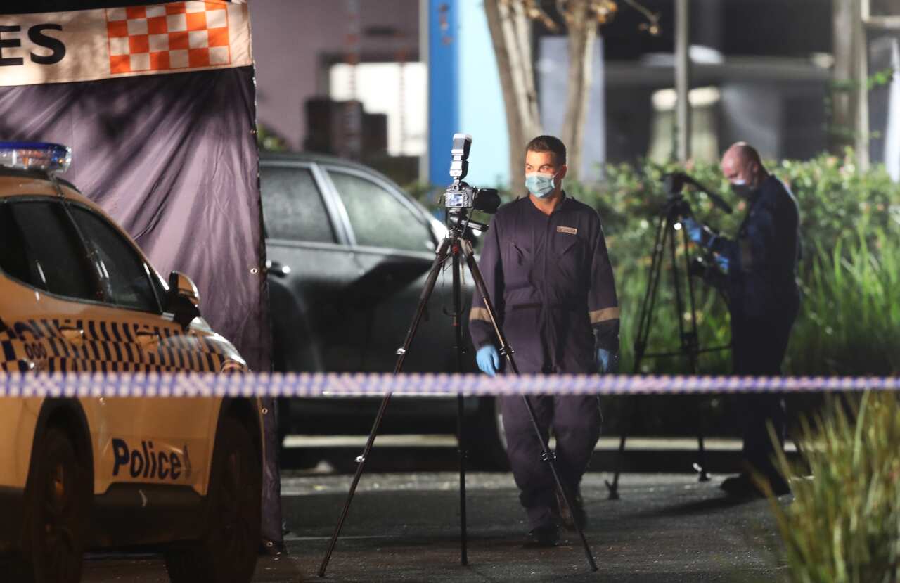 Police at the scene of the stabbing outside a Melbourne shopping centre.