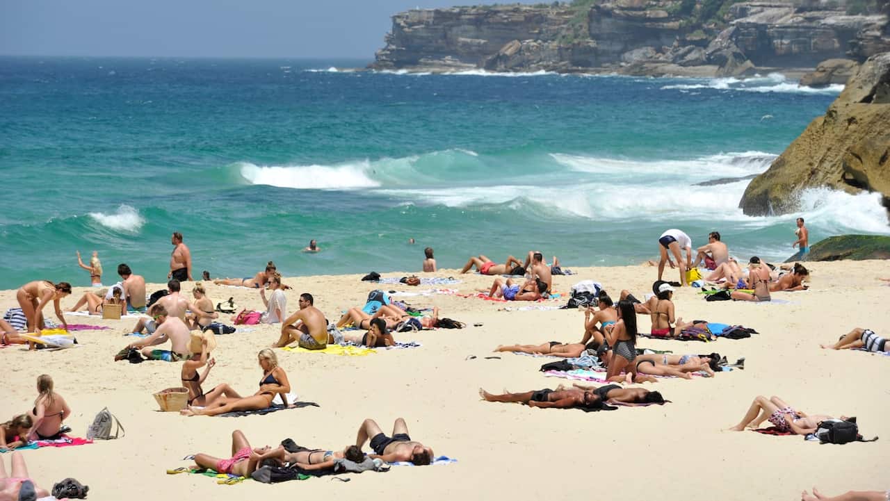 Beachgoers escape the heat at Tamarama Beach in Sydney, Friday, Jan. 13, 2017.