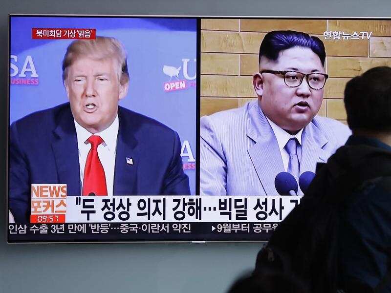 Kim Jong Un (right) orders Nuclear Test site demolition