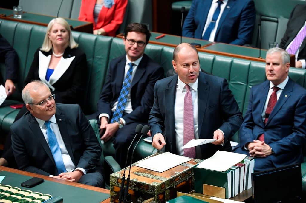 Australian Federal Treasurer Josh Frydenberg presents the 'Tax Relief So Working Australians Keep More Of Their Money' bill during debate in Parliament