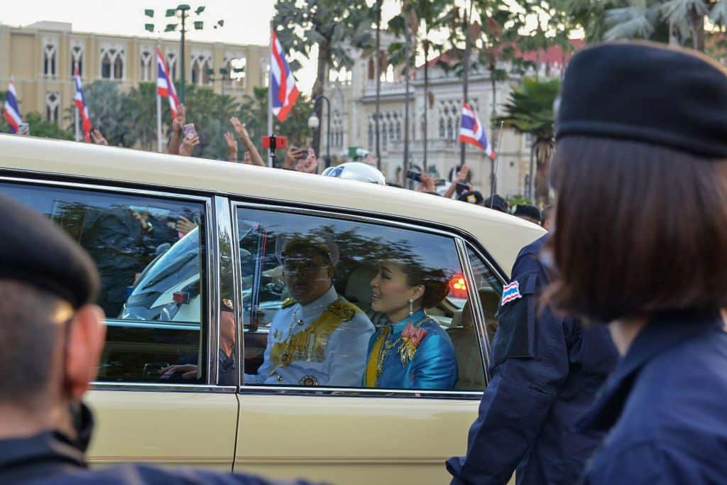 Thailand's Queen Suthida (C) and Prince Dipangkorn Rasmijoti (centre L) 