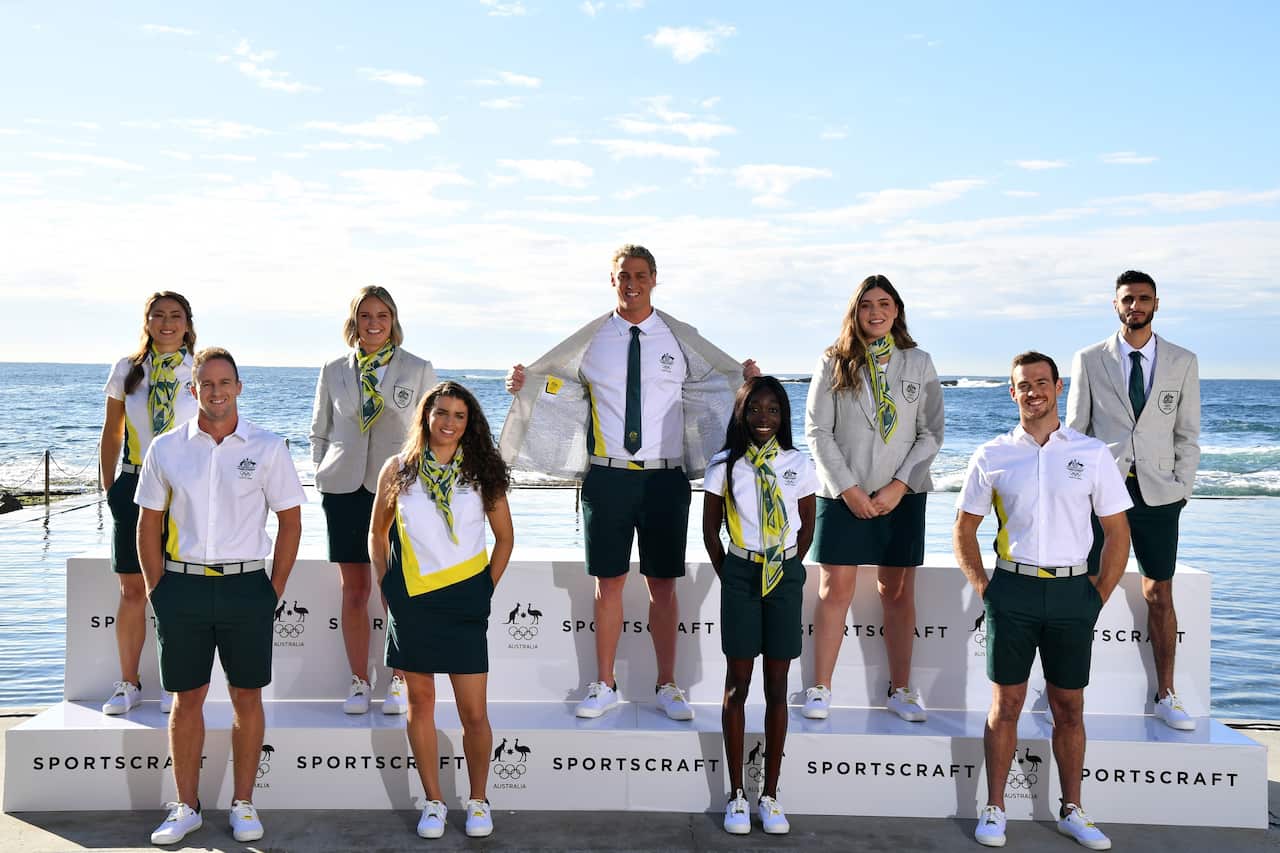 Athletes pose for a photo at the official unveiling of the Australian Olympic Team Opening Ceremony Uniform, in Sydney, Tuesday, May 18, 2021. (AAP Image/Joel Carrett) NO ARCHIVING, EDITORIAL USE ONLY