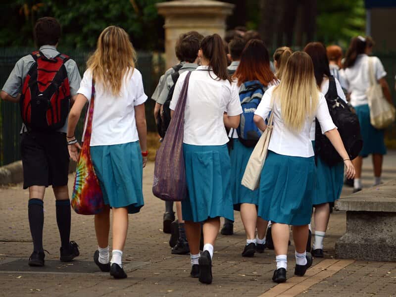 A group of high school students walk together during a school excursion in Brisbane, Friday, Nov. 1, 2013. (AAP Image/Dan Peled) NO ARCHIVING