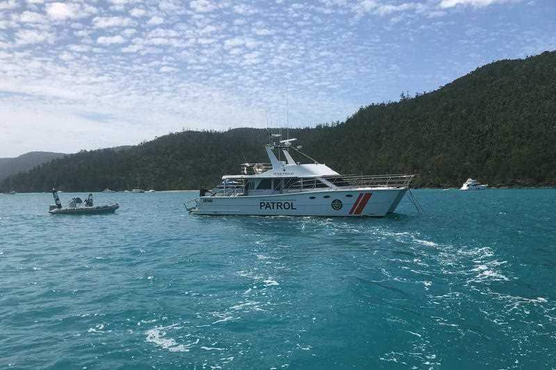 Supplied image of Queensland Boating and Fisheries Patrol boats patrolling Cid Harbour following two shark attacks, Friday, September 21, 2018.