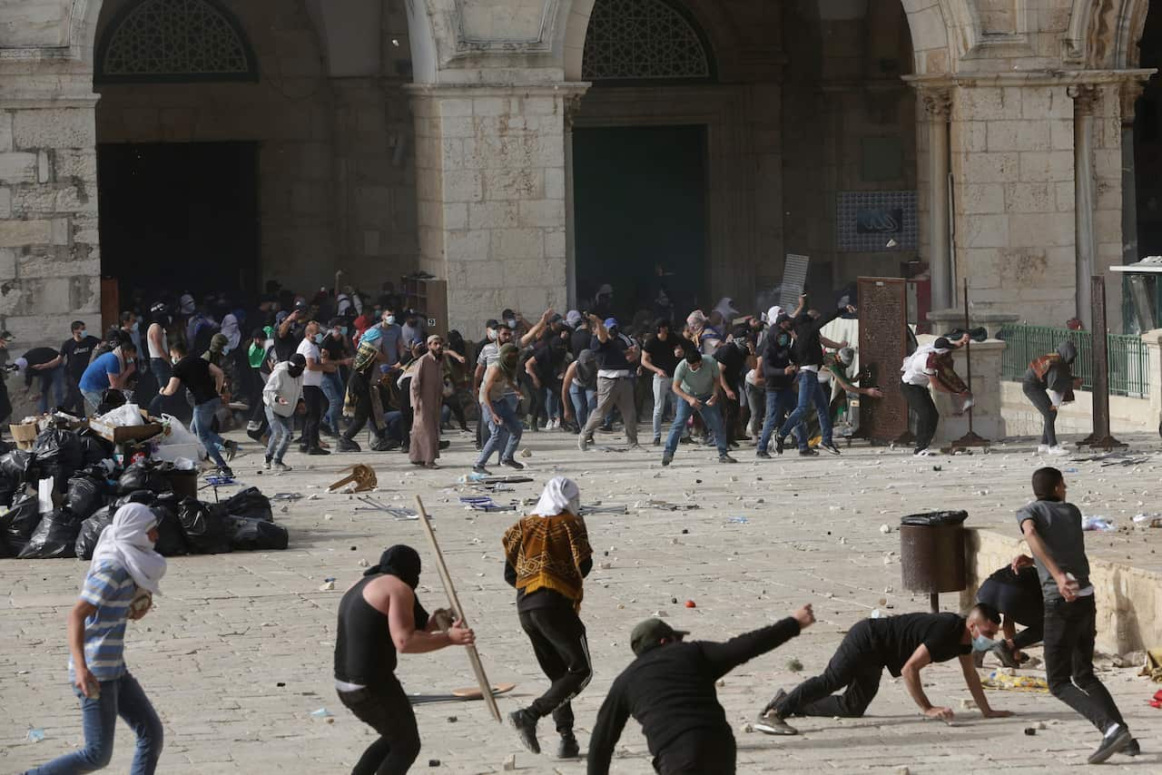 Palestinians clash with Israeli security forces at the Al Aqsa Mosque compound in Jerusalem's Old City Monday, 10 May, 2021. 