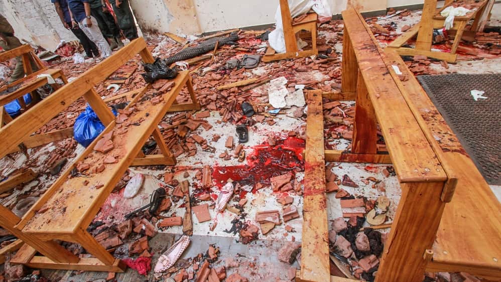 Blood stains are seen inside a church after a bomb blast in Negombo