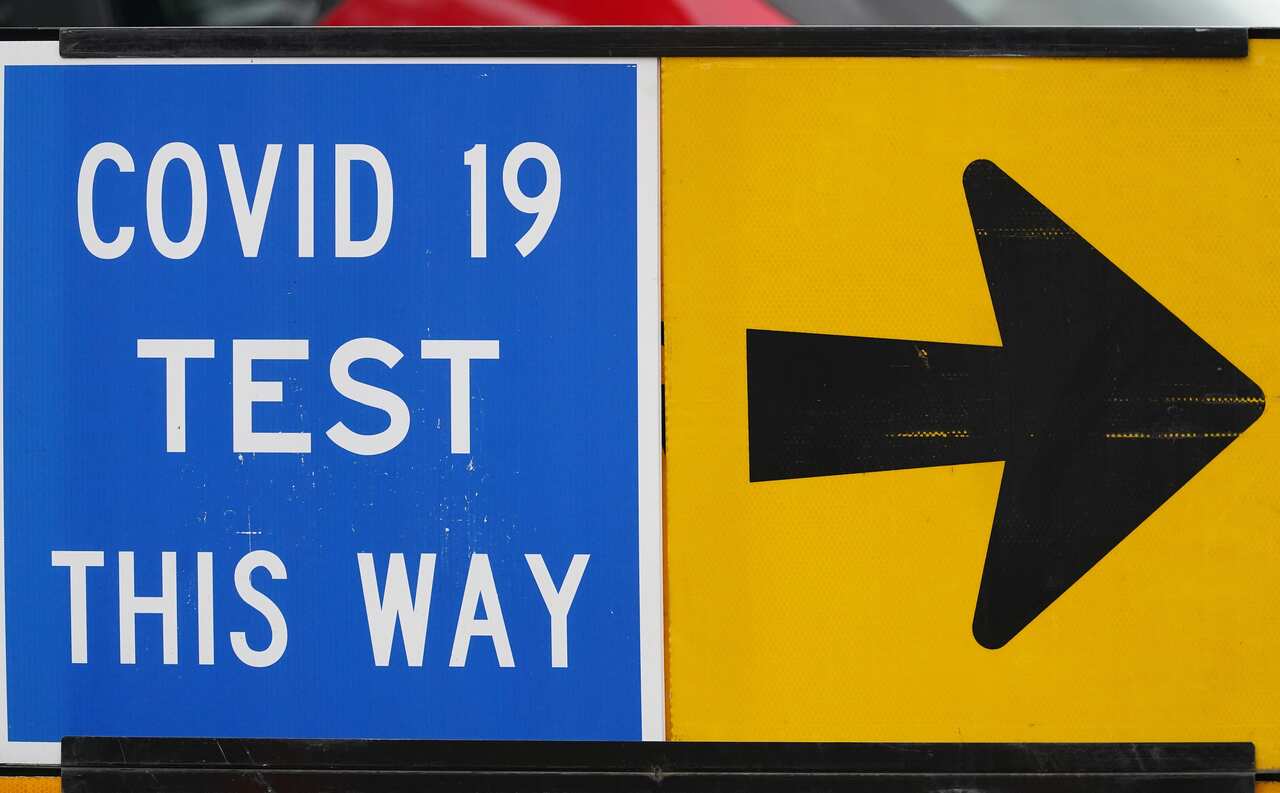A covid testing sign is seen at a drive-through COVID-19 pop-up testing clinic in Melbourne.