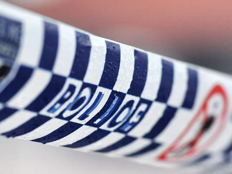 Police tape restricts access to a crime scene