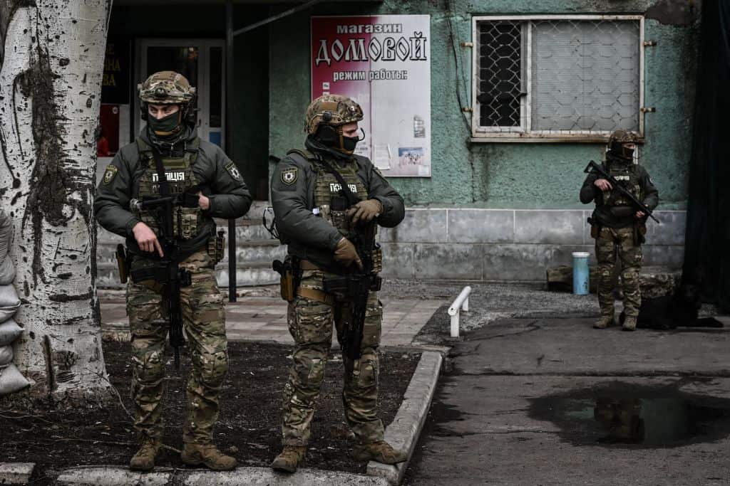 Ukrainian troops patrol in the town of Novoluhanske, eastern Ukraine, on February 19, 2022.