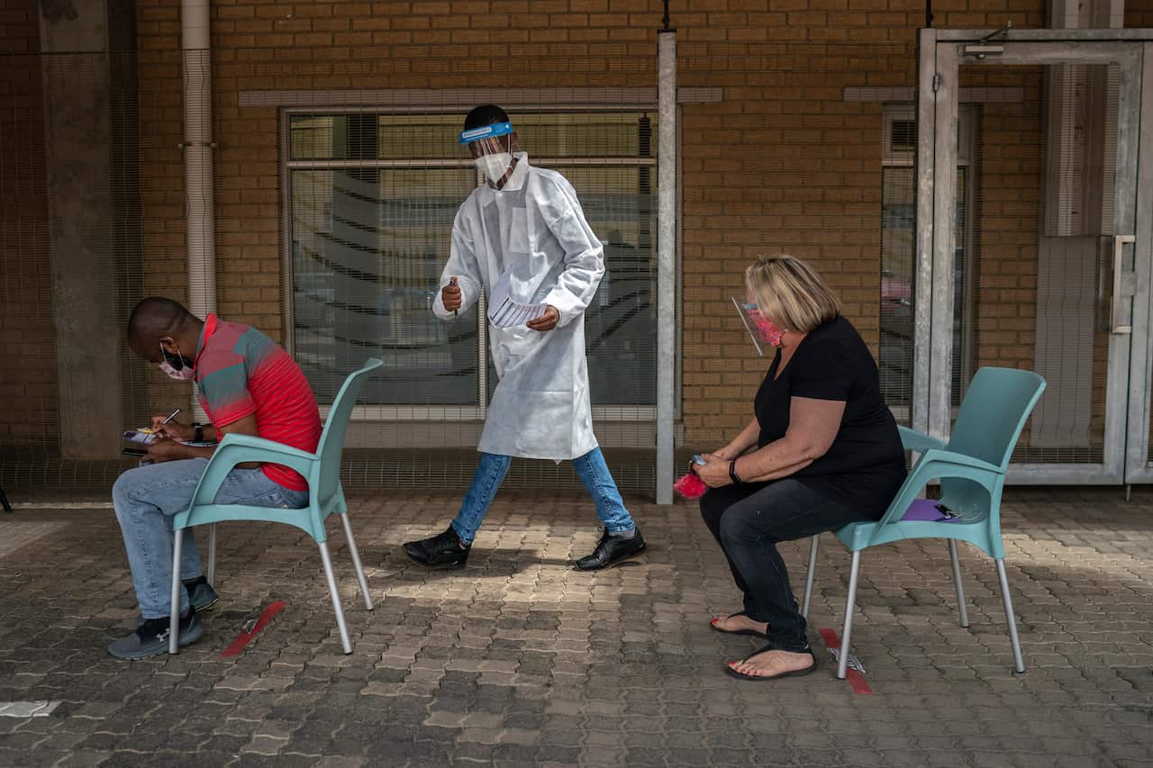 Patients fill out forms before taking a COVID test in Johannesburg, South Africa,.5 January, 2021.