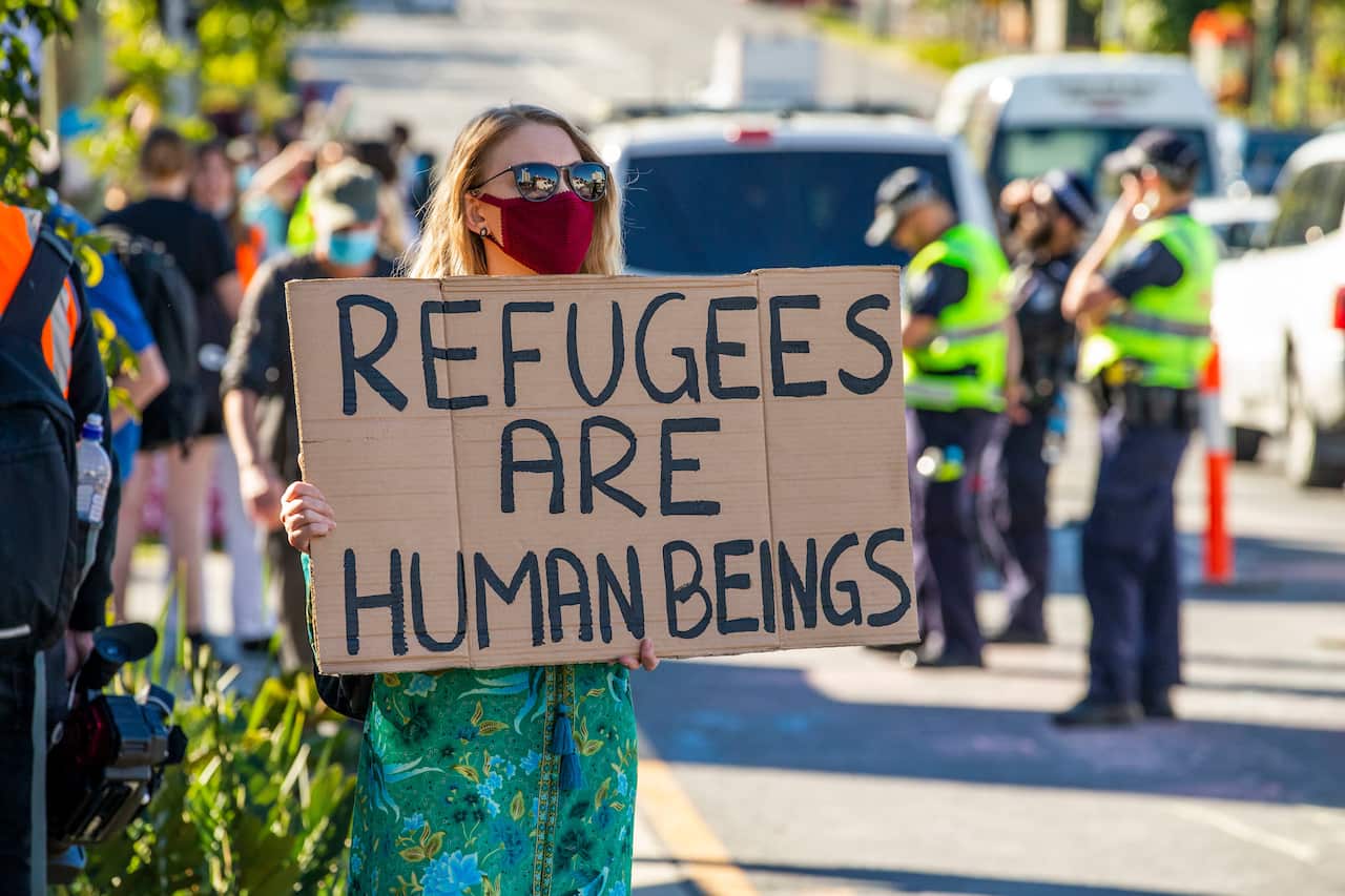 Protesters gather to support asylum seekers detained at the Kangaroo Point Central Hotel.