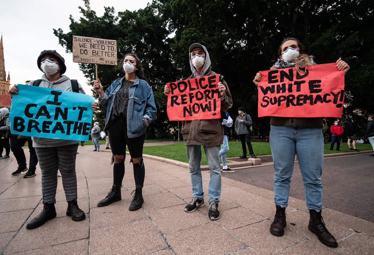 Protesters in Sydney stand in solidarity with protests taking place in the US. 