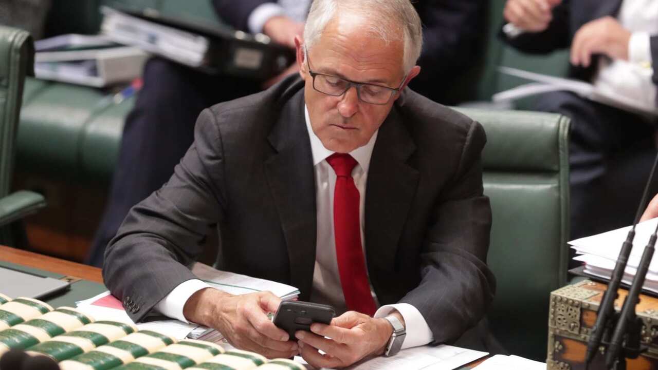 Former prime minister Malcolm Turnbull on his mobile phone