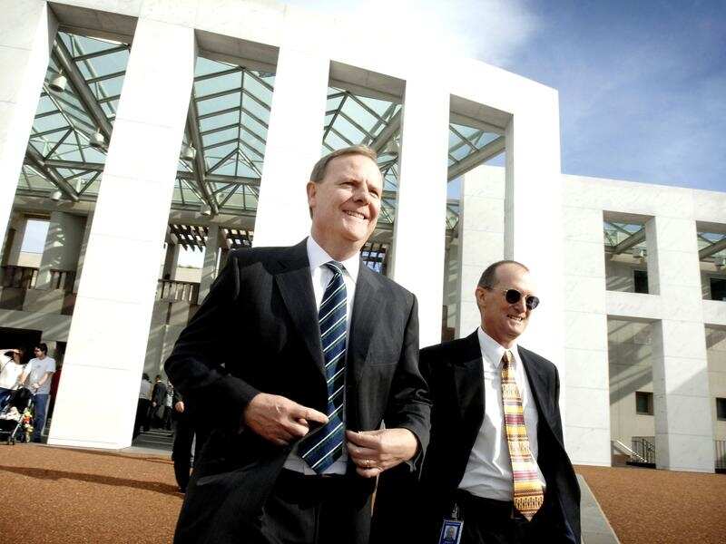 Peter Costello and Phil Gaetjens outside Parliament House in 2007.