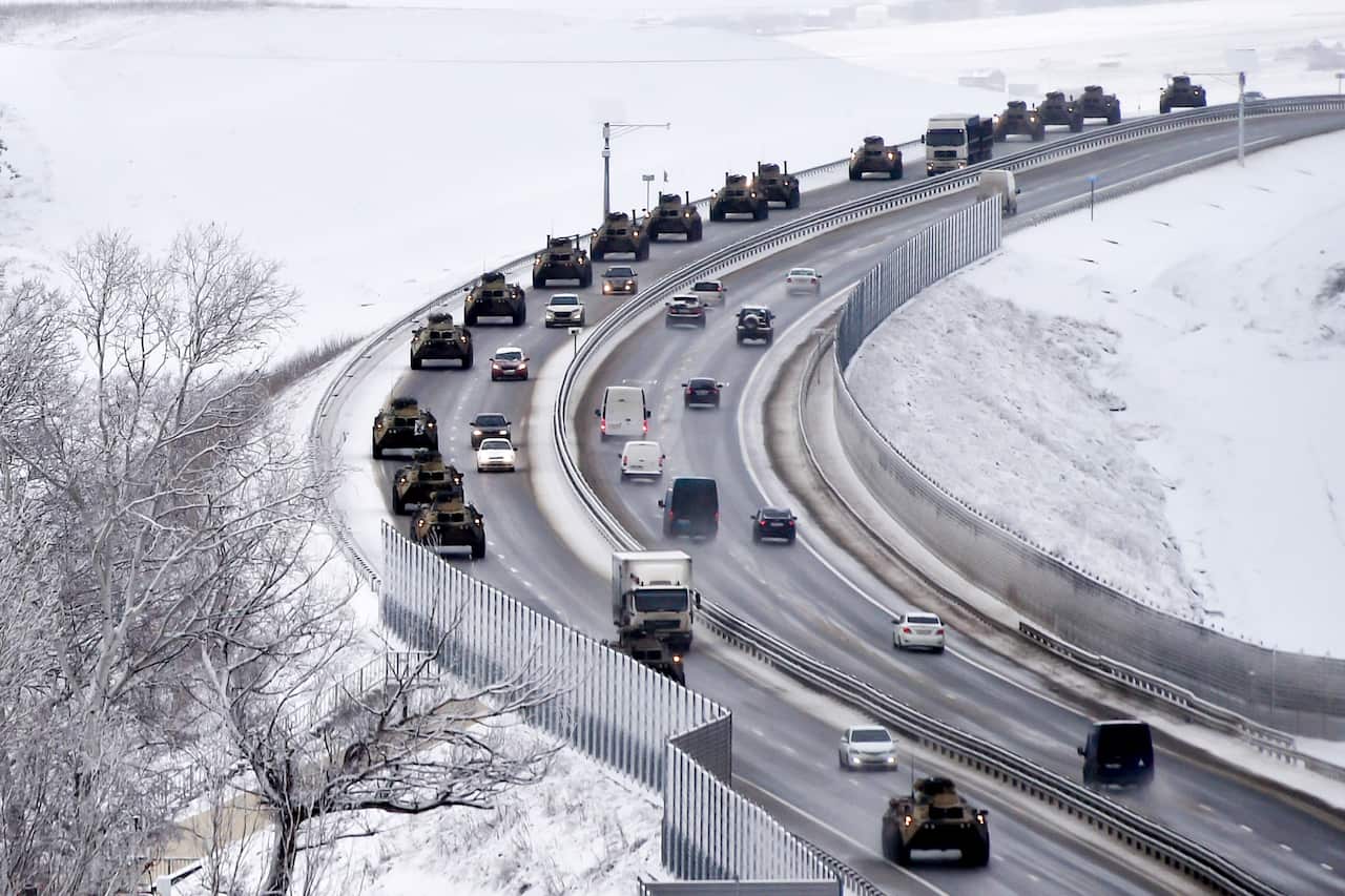 A convoy of Russian armoured vehicles moves along a highway in Crimea on 18 January 2022. 