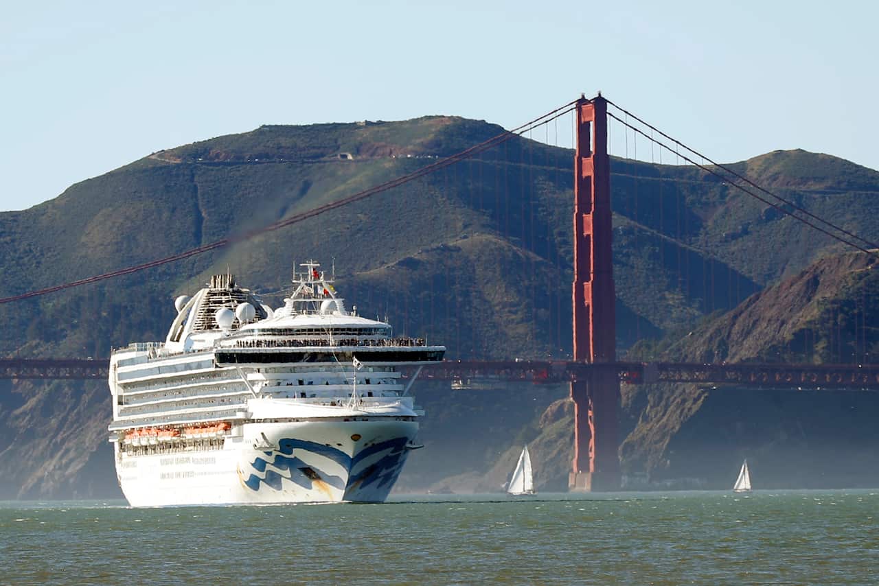 The Grand Princess cruise ship passes the Golden Gate Bridge as it arrives from Hawaii in San Francisco