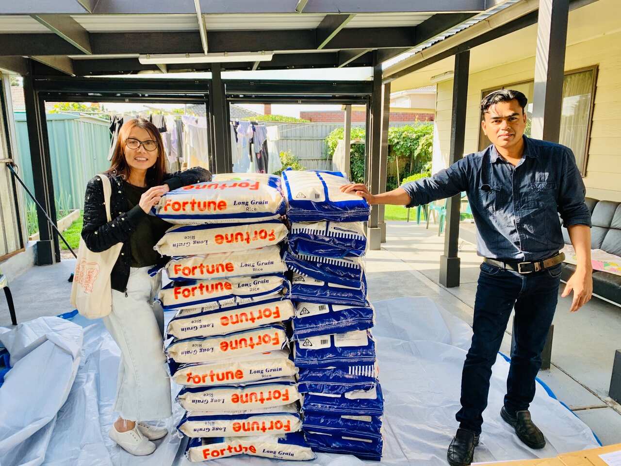 Thien Giang (left) is helping the RCAA distribute food to refugees in need.