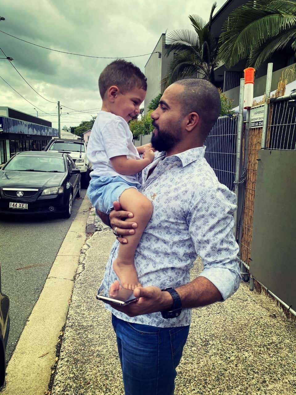 Karrar pictured with his son Mo after leaving hotel quarantine in Brisbane. 