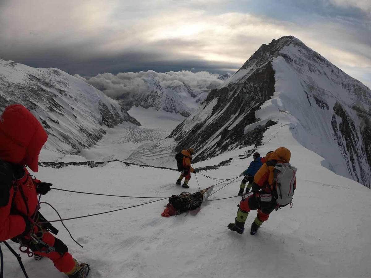 A photo reportedly of the rescuers helping the stranded Australian climber to a safe location.