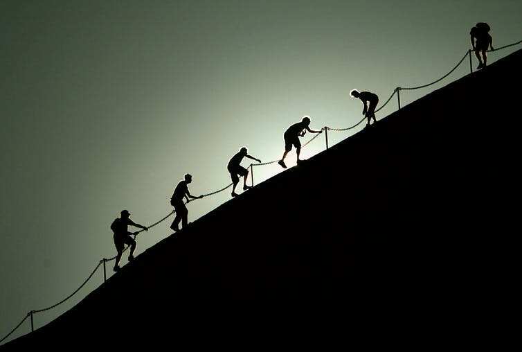 Tourists have previously used a chain to climb Uluru.