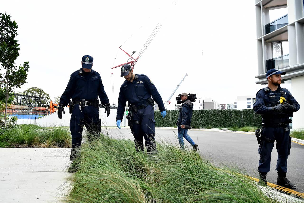 NSW Police at the scene where a woman was found dead at a unit block in Zetland, Sydney.