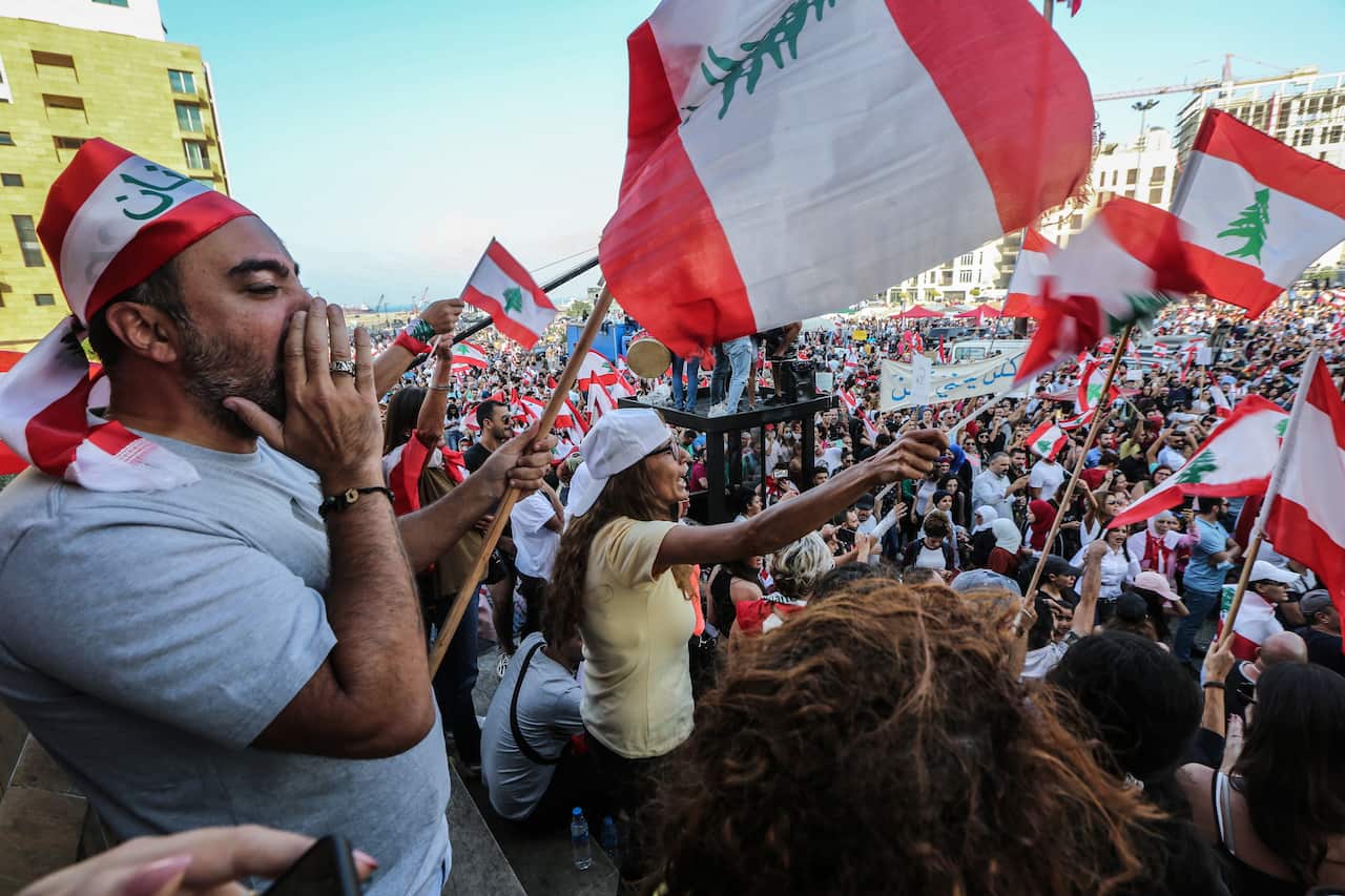 Protesters attend a demonstration against government in front of Muhammad al-Amin Mosque in downtown Beirut, Lebanon.