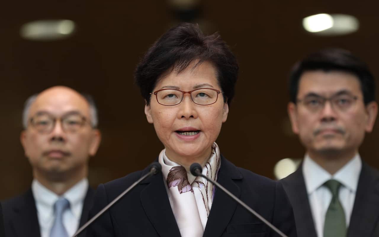 Hong Kong Chief Executive Carrie Lam (C), flanked by Chief Secretary for Administration, Matthew Cheung Kin-chung (L) and the Financial Secretary Paul Chan (R)