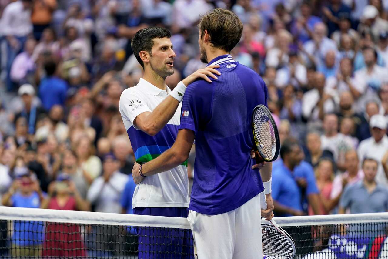 Novak Djokovic, of Serbia, left, congratulates Daniil Medvedev, of Russia, after Medvedev won the mens singles final of the US Open tennis championships.