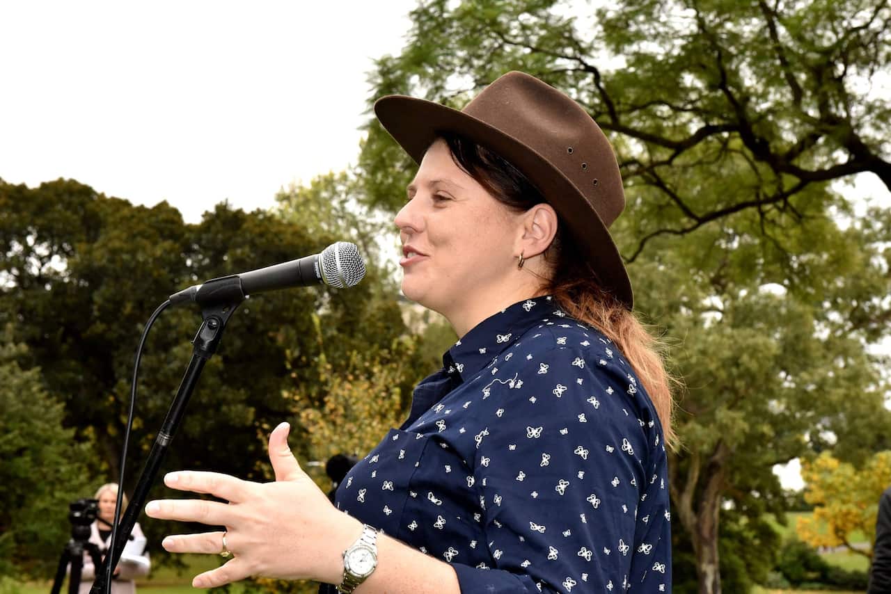 Angela addresses a protest calling for the return of the family to Biloela.