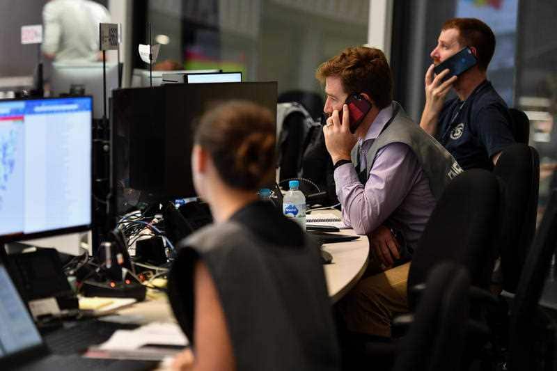 People at the NSW RFS Headquarters State Operations Centre in Sydney, Sunday, January 5, 2020.