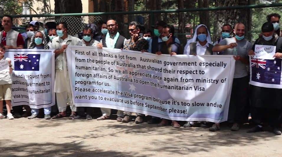 Almost 150 former staff of Australia's embassy in Kabul stage a protest at the slow processing of visas.