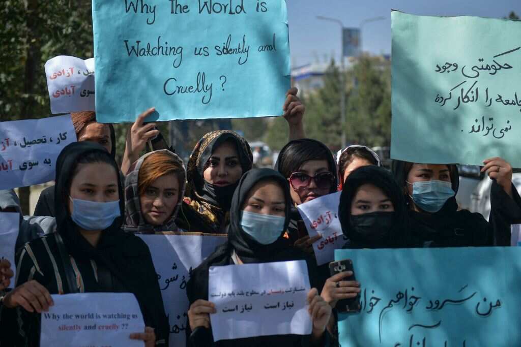 Afghan women hold banners and placards as they take part in an anti-Pakistan protest in Kabul on September 8, 2021. 