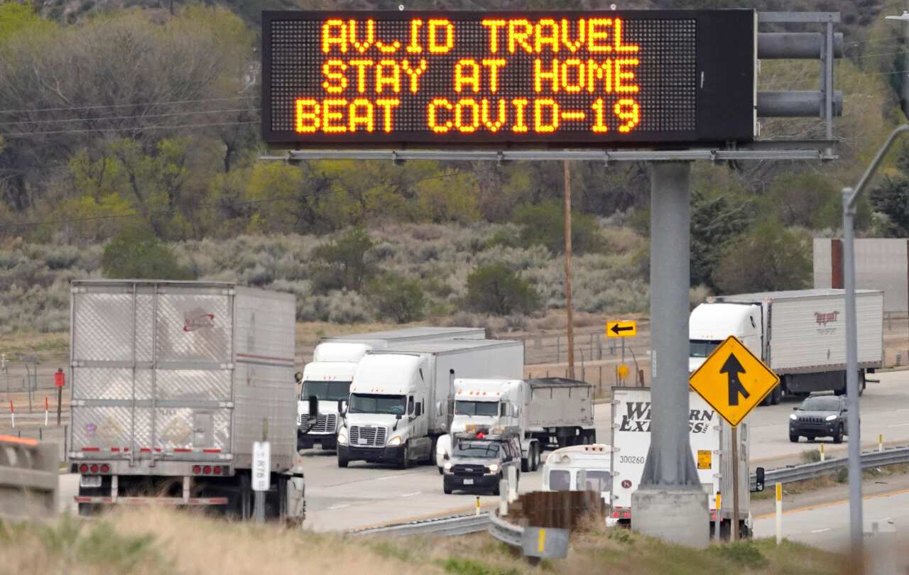 A freeway sign urges people on their way into Los Angeles to stay at home due to the coronavirus outbreak.