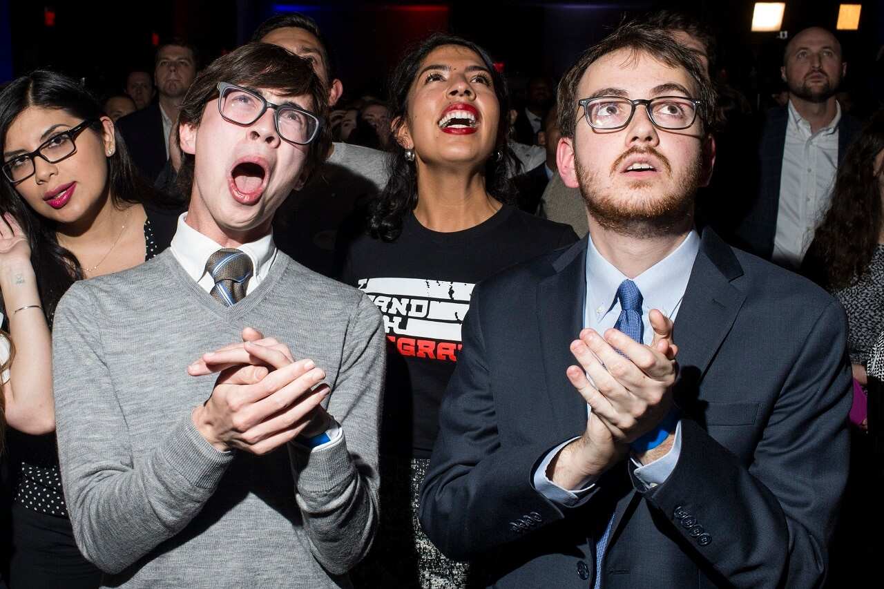 People react to midterm election results during a DCCC election watch party.