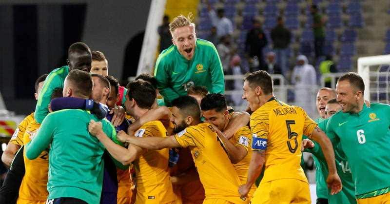 Players of Australia celebrate after winning the penalty shootout during the 2019 AFC Asian Cup round of 16