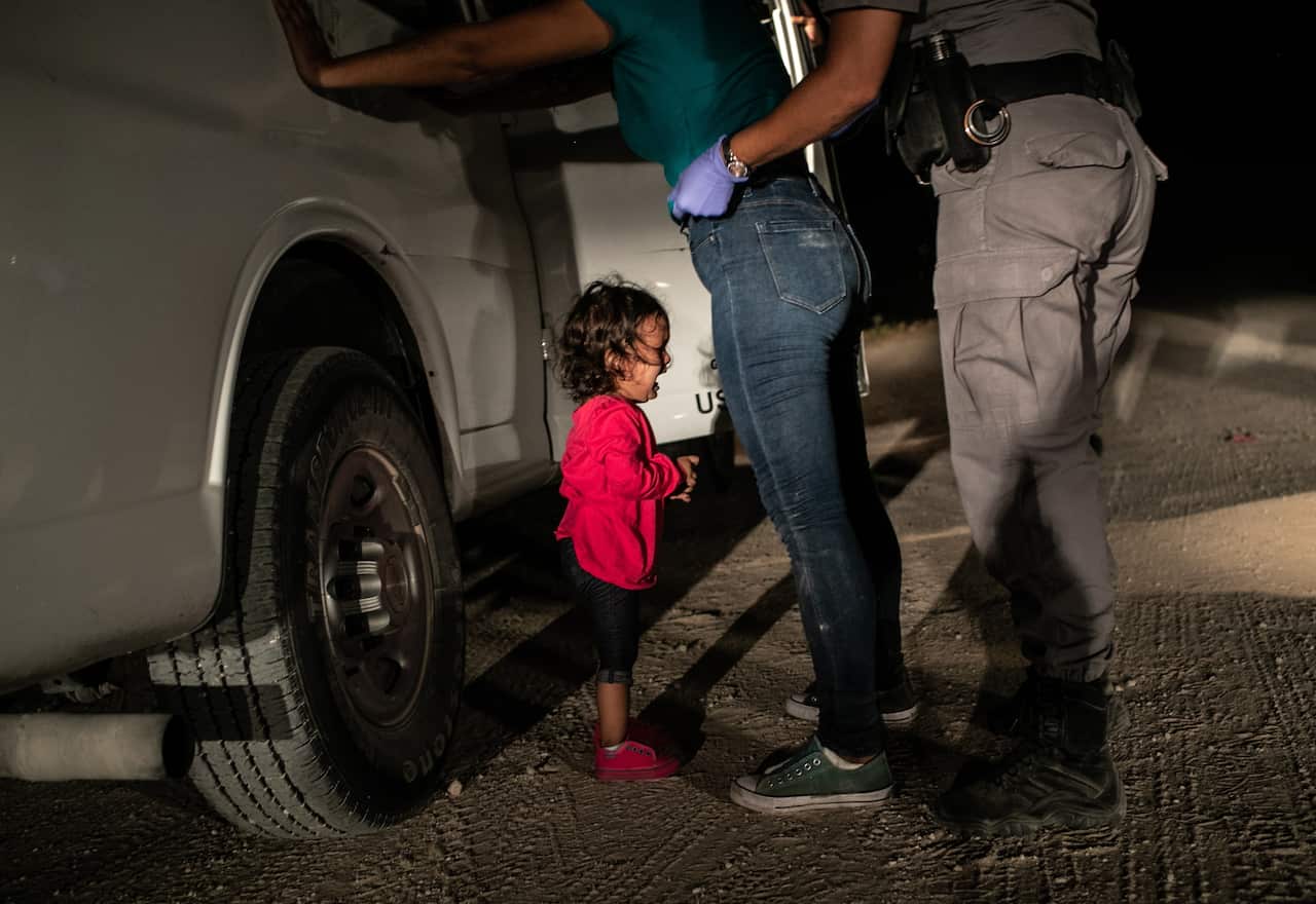 The World Press Photo's 2019 Picture of the Year shows a two-year-old asylum seeker crying as her mother is searched and detained near the US-Mexico border.