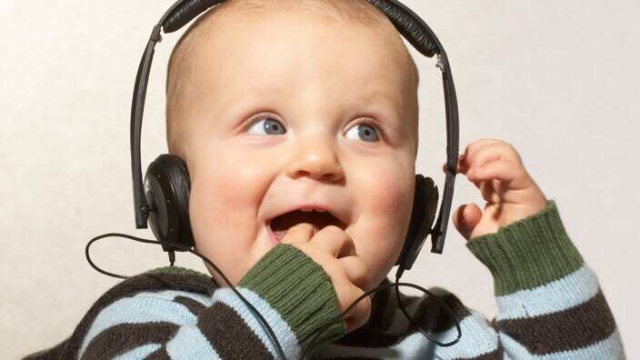 happy baby listening to music