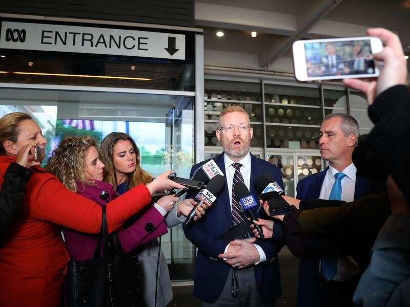 ABC Editorial Director Craig McMurtie (C) has called the AFP raid an "uncomfortable development".