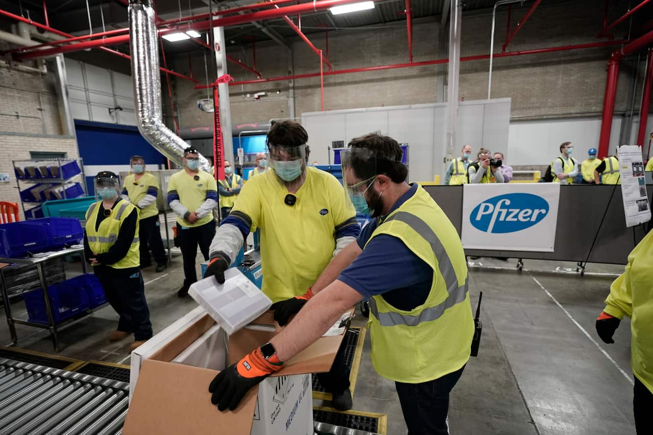Boxes containing the Pfizer-BioNTech COVID-19 vaccine are prepared to be shipped at the Pfizer Global Supply Kalamazoo manufacturing plant in Michigan.