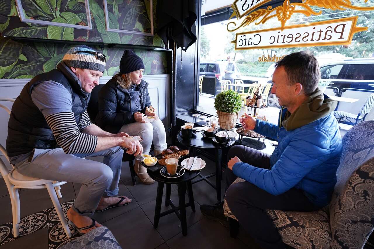 Patrons are seen having coffee at Flavours Patisserie Cafe in Parkdale, Victoria.