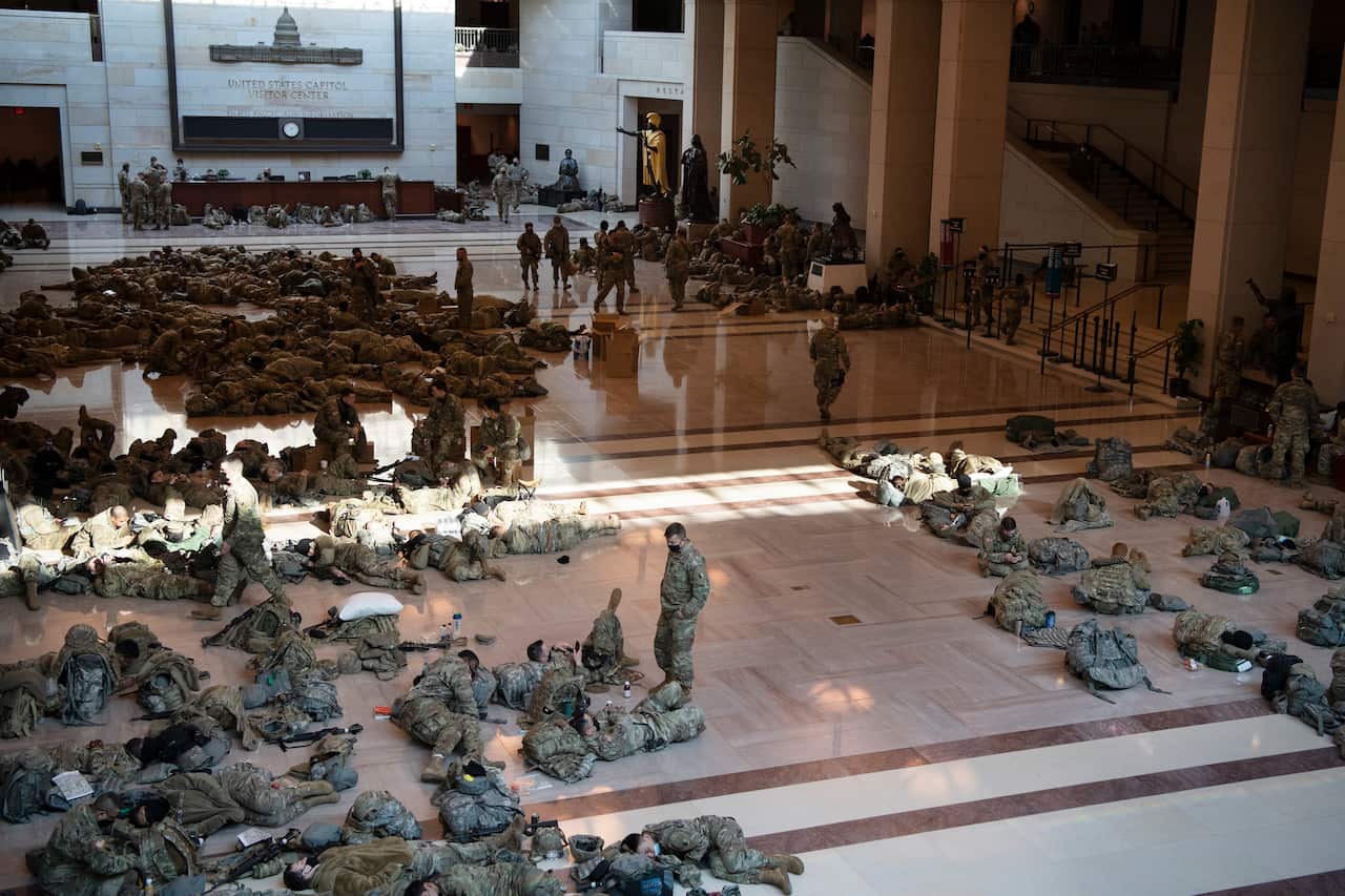 Photographs are going viral of National Guard troops keeping watch over the Capitol.
