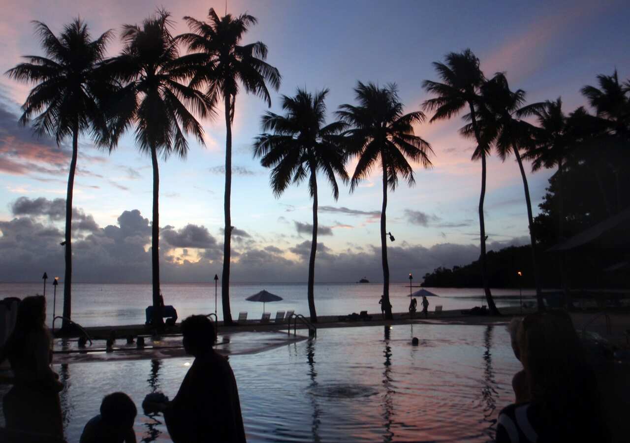 The sun sets over the ocean at Palau Pacific Resort in Palau.