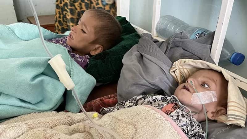 The few remaining doctors and nurses try urgently to treat babies and malnourished children.