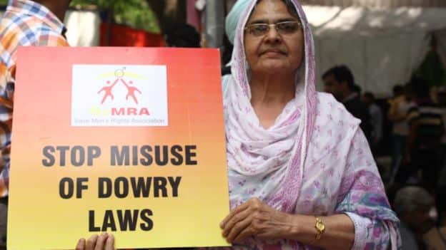 A woman protests the misuse of anti-dowry laws