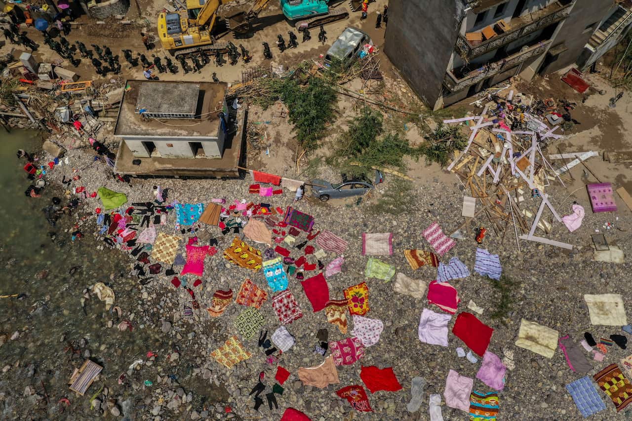 Rescuers conduct rescue operation in landslide area caused by Typhoon Lekima, in China's Zhejiang province, 11 August 2019.