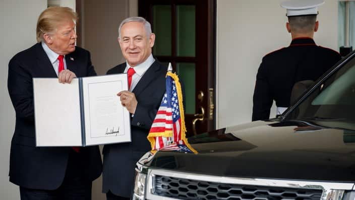 US President Donald Trump (L) and Prime Minister of Israel Benjamin Netanyahu with the signed Presidential proclamation on the Golan Heights